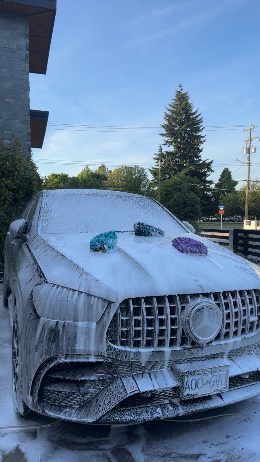 Mercedes AMG GLE covered in snow foam during a hand wash