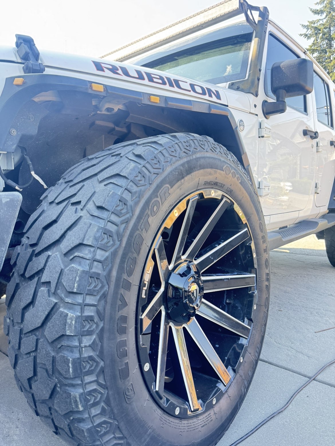 Dusty white Jeep Rubicon before a full exterior detail