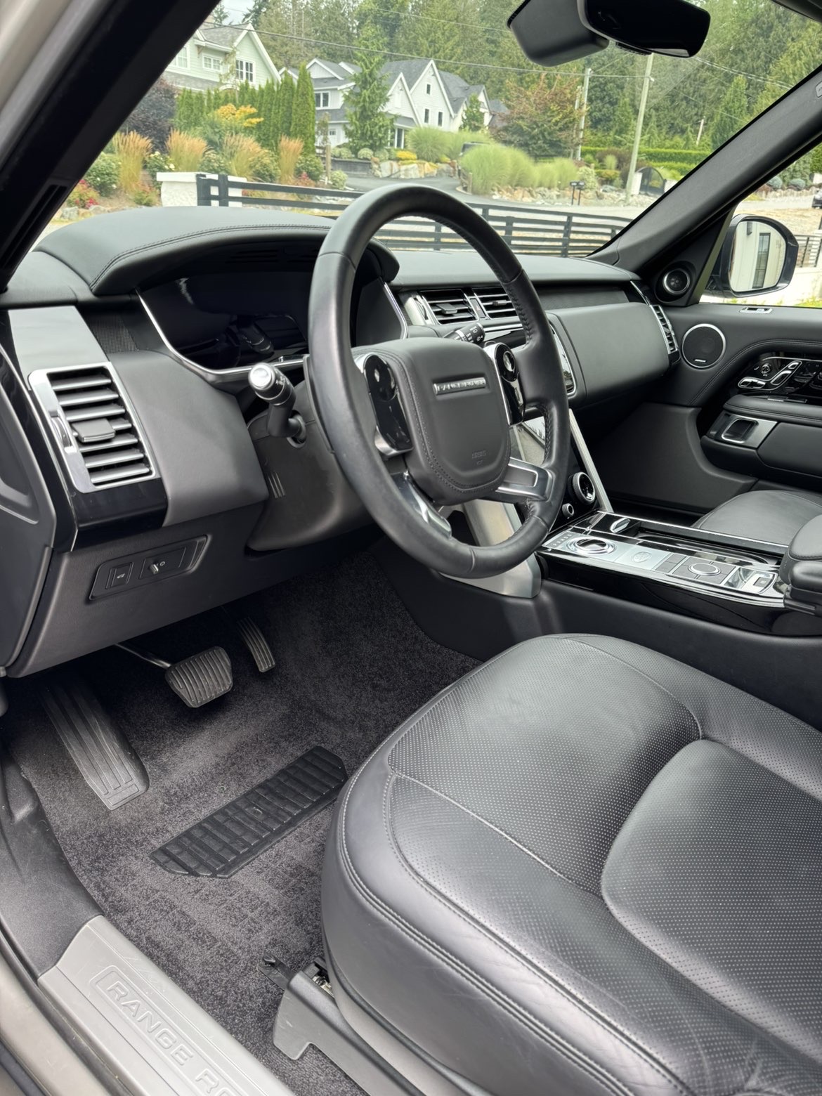 Range Rover interior detailed with clean black leather and carpets