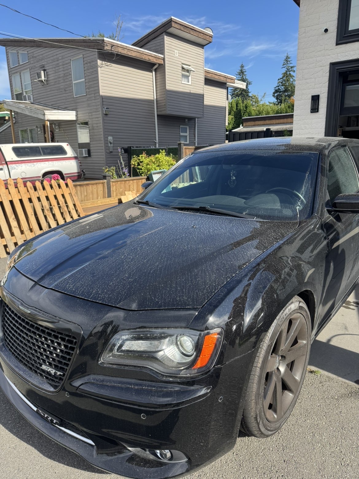 Dusty Chrysler 300 SRT before an exterior detail in Abbotsford